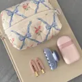 Floral makeup bag in cream with pink roses, matching hair clips and earphone case - Blue Bow Rose
