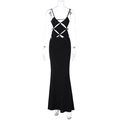 Detail of black backless maxi dress featuring waist cutout and mermaid silhouette - S / Black