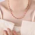 Elegant gold necklace featuring vibrant red evil eye beads on a minimalist chain - Red Necklace