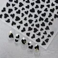Stickers à ongles cœurs noir et doré élégants avec des modèles pour manucure DIY - Noir