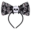 Detail of Halloween headband with black bow, white skull patterns and heart-eyed skull center - Skull Bow