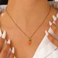 Close-up of a carrot enamel pendant necklace on a model wearing a white shirt - Carrot Style (DZ-193)