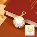 Gold Virgo zodiac coin pendant with white pearl and star crystals on a red book - Virgo Style