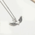 Silver twisted chain necklace with heart wings pendant featuring black pavé set crystals - Silver Winged Heart