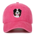 Close-up of pink washed cotton baseball cap featuring detailed Bernese Mountain Dog embroidery - Rose Red