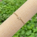 Minimalist 18K gold beaded elastic bracelet featuring a sparkling crystal letter A charm - Gold A