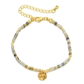 Detail of multi-color faceted stone beads with gold hammered disc charm and lobster clasp - Gray