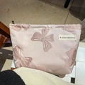 Pink satin makeup bag with embroidered bow design and secure zipper top closure - Solid Bow Decor Pink