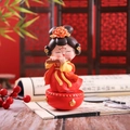 Traditional Chinese girl figurine in red dress playing flute on tumbler base - Flute Playing Style (1088-36) / 1 Piece (Medium) / Red Gold