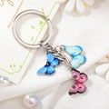 Detail of colorful enamel butterfly pendants on silver keychain with floral props - Style 4 M742