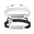 Detail of couple bracelets with magnetic heart buckle and You are my person engraving - You are my person