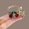 Pince à cheveux cerise dorée avec strass rouges et verts pour queues de cheval hautes - Cerise Plein Strass / Or