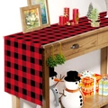 Detailed close-up of red and black plaid Christmas table runner on a wooden surface - 181x35.5cm / Black & Red Plaid