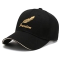 Black trucker cap with Freedom feather embroidery and breathable mesh in 45-degree view - Black with Gold Embroidery