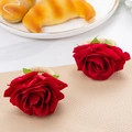 Two red fabric rose napkin rings with green leaves on natural woven jute fiber loops - Artificial Red Rose