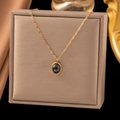 Minimalist 18K gold plated titanium necklace with an oval black stone pendant - Black Cat's Eye Stone (H1023) Gold