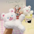 Cute white fuzzy teddy bear plush keychain with blue eyes and silver bell attachment - White - Pounce Style
