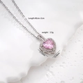 Silver necklace with pink heart-shaped pendant and cubic zirconia halo on white background - Necklace / Pink