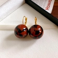 Macro shot of leopard print resin earrings with golden hooks in a white velvet jewelry box - 15# Leverback - Gold Coffee Black (Ball Pendant)
