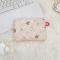 Close-up of pink quilted cosmetic pouch with cute dog pattern on white plush surface - Purple Bowknot Rabbit