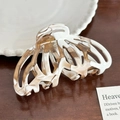 Acetate hair claw clip featuring a white and amber marble pattern butterfly design - Pumpkin Claw Clip-9.5cm