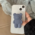 Matte dark grey bear phone socket grip on white smartphone with skin-friendly silicone finish - Transparent Stand / Grey 3D Bear