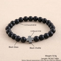 Detail view of black glass and hematite bead bracelet with 0.8cm beads and cross charm - Matte Black Glass Black Cholite Cross 19cm