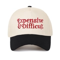 Close-up of red Expensive & Difficult embroidery on two-tone cream and black baseball cap - Beige/Black