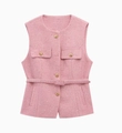 Close-up of pink tweed vest texture with golden embossed buttons and matching belt detail - Pink