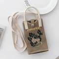 Detail of knitted phone bag with pumpkin embroidery and sturdy snap button closure - Khaki Pumpkin