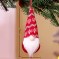 Hanging 15cm Christmas gnome with red and grey knitted hat on a green tree branch - Style F