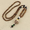 Vintage wooden Buddhist bead necklace with carved lotus pendant and colorful accents - Blue Bead Lotus Wood Chain