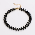 Detail showing double-strand black beaded necklace with gold clasp and adjustable chain - Black