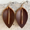 Brown crazy horse leather leaf earrings with gold metal bar pendants on a stone surface - Brown Leather Leaf with Long Gold Bar