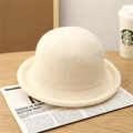 Close-up of off-white knitted bucket hat showing premium wool texture and rolled brim - Off White