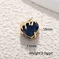 Detail of 18K gold heart pendant with deep blue gemstone and melted gold texture - Melted Deep Blue Heart