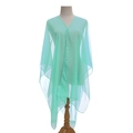 Mint green sheer summer shawl with elegant pearl buttons on a fashion mannequin - Green