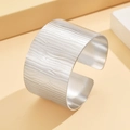 Silver wide cuff bracelet with vintage textured pattern in irregular stainless steel finish - Steel