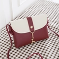Mini PU leather crossbody bag in burgundy and beige with a gold deer pendant charm - Burgundy