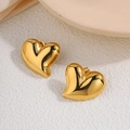 Minimalist gold-plated heart stud earrings with a polished mirror finish on a beige surface - Polished Heart Stud Earrings