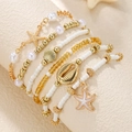 Bohemian gold layered bracelet set with starfish shells and pearl beads for beach vacation - Gold Cream Sea Star Shell Bracelet Set