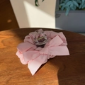 Close-up of pink lace bow hair claw clip on brown wooden background with soft lighting - Barbie Pink Bowknot Hair Claw