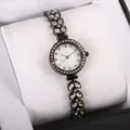 Gunmetal mermaid watch with leaf-shaped diamond strap and pearl dial on velvet pillow - Black
