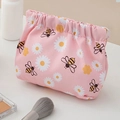 Pink drawstring makeup bag with daisy and bee print for lipstick and coin storage - Drawstring Style / Bee