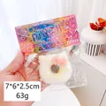 Weißes katzenförmiges Squishy-Spielzeug mit bunten Streuseln und rosa Schleife - Hello Kitty Weißer Donut