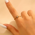 Detail of a gold-plated star ring with pavé-set zircons worn by a model hand - 18k Gold Plated (7475)