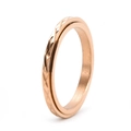 Close-up of rose gold spinning ring with geometric diamond-cut patterns and facets - US 5 / Rose Gold