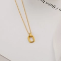 Minimalist gold titanium steel necklace featuring a hollow rectangular pendant on cross chain - Geometric Double Loop