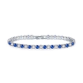 Detailed close-up of sapphire and cubic zirconia tennis bracelet with silver plating - 17cm / White Gold + White Blue