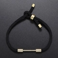 Adjustable black woven rope bracelet with gold metal accents and sliding closure design - Black